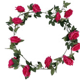Huitich artificial rose wall decor featuring vibrant pink artificial flowers with green leaves arranged in a circular garland